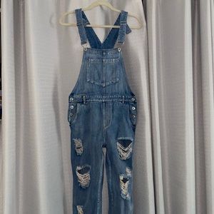 Distressed light wash overalls